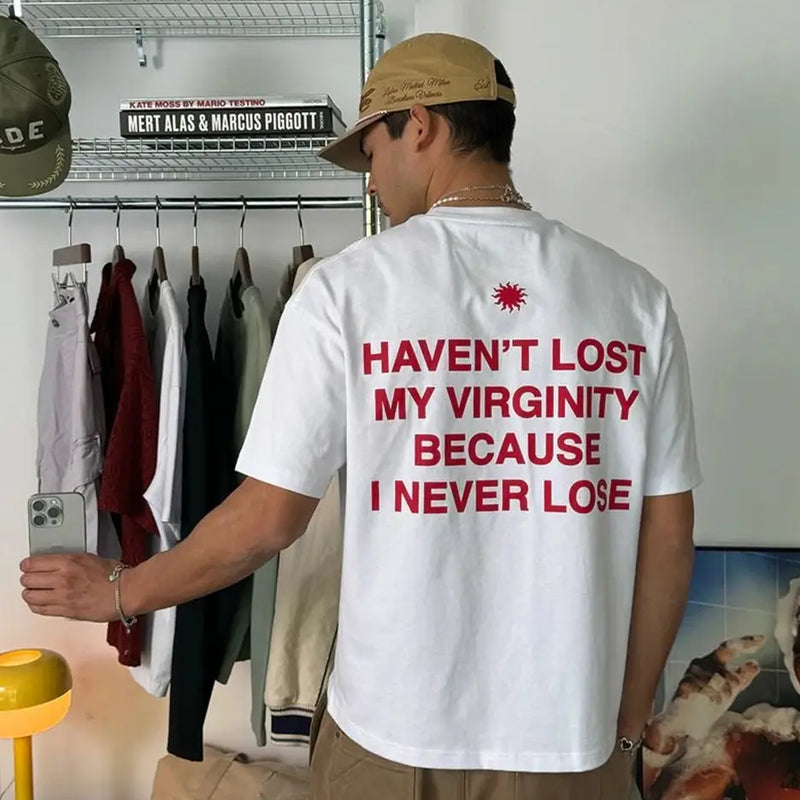 Funny Men’s White Graphic T-Shirt – “Haven’t Lost My Virginity Because I Never Lose” Statement Tee