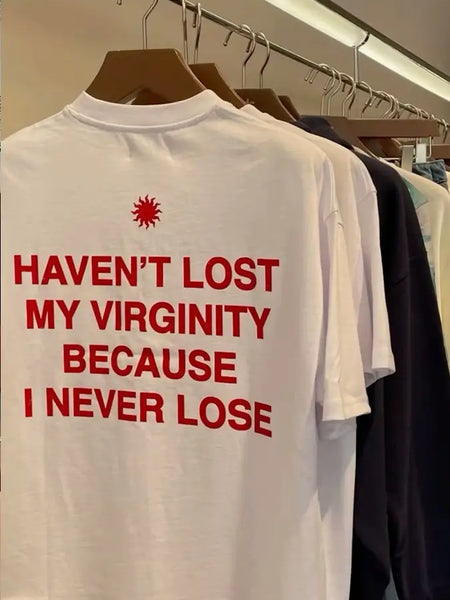Trendy Women’s White Graphic Tee – “Haven’t Lost My Virginity Because I Never Lose” Funny Statement Shirt