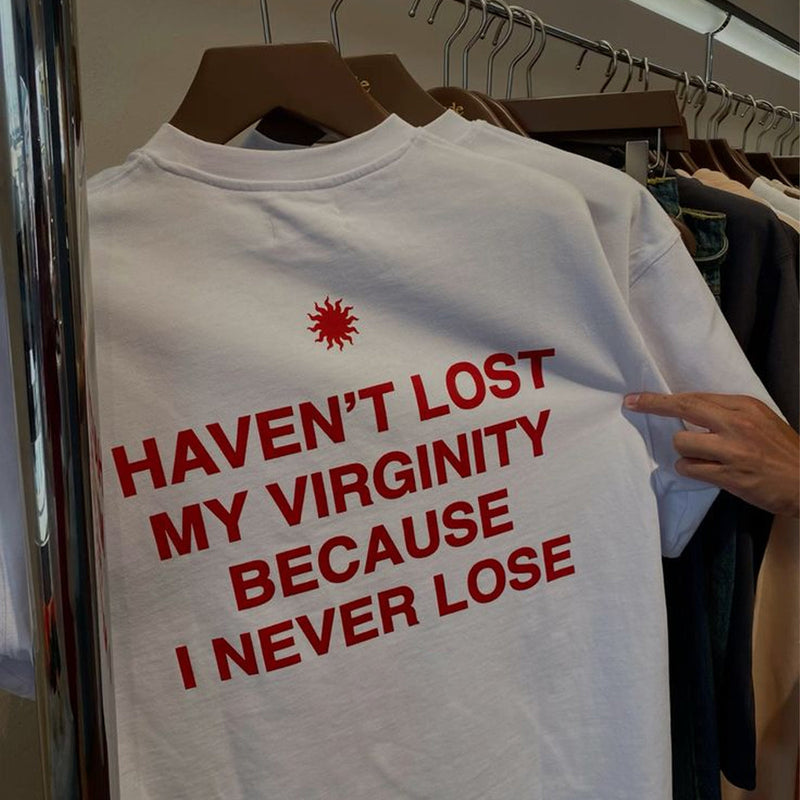 Funny Men’s White Graphic T-Shirt – “Haven’t Lost My Virginity Because I Never Lose” Statement Tee