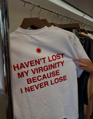 Funny Men’s White Graphic T-Shirt – “Haven’t Lost My Virginity Because I Never Lose” Statement Tee