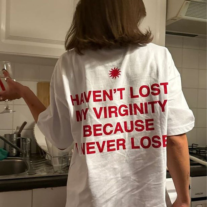 Trendy Women’s White Graphic Tee – “Haven’t Lost My Virginity Because I Never Lose” Funny Statement Shirt