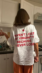 Trendy Women’s White Graphic Tee – “Haven’t Lost My Virginity Because I Never Lose” Funny Statement Shirt