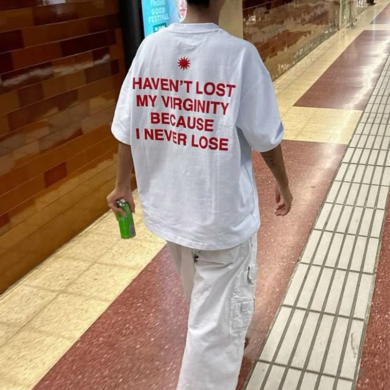 Trendy Women’s White Graphic Tee – “Haven’t Lost My Virginity Because I Never Lose” Funny Statement Shirt