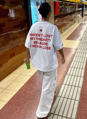 Trendy Women’s White Graphic Tee – “Haven’t Lost My Virginity Because I Never Lose” Funny Statement Shirt